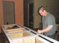 TJ, from Creative Countertops, measuring for the kitchen countertops